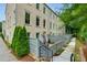 Brick townhome with fenced patio and sidewalk access; an inviting and private outdoor space at 302 Boxwood Ln, Roswell, GA 30075
