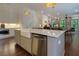 Spacious kitchen features a large island with a farmhouse sink, stainless steel appliances, and seamless open living concept at 302 Boxwood Ln, Roswell, GA 30075
