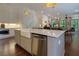 Kitchen island with white countertops, stainless steel dishwasher, and farmhouse sink at 302 Boxwood Ln, Roswell, GA 30075