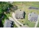 Aerial view of home showcasing landscaping, large lot, driveway, and neighborhood at 332 Warwick Pl, Mcdonough, GA 30253