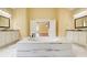 The bathroom features a large soaking tub, marble floors, and dual vanities with granite countertops at 332 Warwick Pl, Mcdonough, GA 30253