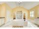 Bright bathroom features a large soaking tub, a walk-in shower, and dual vanities with granite countertops at 332 Warwick Pl, Mcdonough, GA 30253