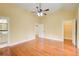 The spacious bedroom with hardwood floors features two doors and an ensuite bathroom at 332 Warwick Pl, Mcdonough, GA 30253
