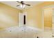 Bedroom boasts marble floors, neutral paint, ceiling fan, and access to closet and other rooms at 332 Warwick Pl, Mcdonough, GA 30253