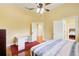 A bedroom with an adjacent bathroom and a peek into another bedroom at 332 Warwick Pl, Mcdonough, GA 30253
