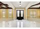 Grand foyer featuring marble floors, high ceilings, coffered details, and a view of the front doors at 332 Warwick Pl, Mcdonough, GA 30253