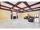 Large living area with marble tile flooring, fireplace with stone accents, and a leather reclining sofa at 332 Warwick Pl, Mcdonough, GA 30253