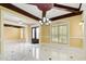 Open-concept living room boasts marble floors, coffered ceilings, and lots of natural light at 332 Warwick Pl, Mcdonough, GA 30253