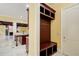 Mudroom features a built-in bench with storage and access to the kitchen and the outside at 332 Warwick Pl, Mcdonough, GA 30253