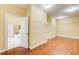 Large walk-in closet with shelving, hardwood floors, neutral walls, and an open entrance leading to the bathroom at 332 Warwick Pl, Mcdonough, GA 30253