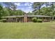 Charming brick home featuring a classic design and a lush, green front yard at 3630 Spot Rd, Cumming, GA 30040