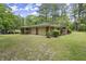 Attached two-car garage offering convenience and ample parking space, surrounded by lush greenery at 3630 Spot Rd, Cumming, GA 30040