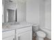 Clean bathroom with modern vanity, white cabinets, and tub with subway tile surround at 5448 Howington E Ct # 194, Buford, GA 30518