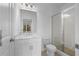 Modern bathroom with glass enclosed shower, white vanity, and neutral color scheme at 5448 Howington E Ct # 194, Buford, GA 30518