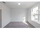 Bright, carpeted bedroom with natural light at 5448 Howington E Ct # 194, Buford, GA 30518