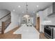 Open concept kitchen with island, stainless steel appliances, perfect for entertaining and Gathering gatherings at 5448 Howington E Ct # 194, Buford, GA 30518
