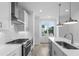 Well-lit kitchen with stainless steel appliances and subway tile backsplash, and modern fixtures at 5448 Howington E Ct # 194, Buford, GA 30518