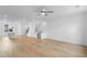 Spacious open-concept living space with hardwood floors and plenty of natural light at 5448 Howington E Ct # 194, Buford, GA 30518