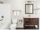 Well-lit bathroom with a dark wood vanity, marble countertop, and shower-tub combination at 800 Peachtree Ne St # 8531, Atlanta, GA 30308