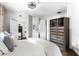 Bedroom with exposed brick accents, an open closet system, and en suite bathroom at 800 Peachtree Ne St # 8531, Atlanta, GA 30308
