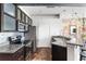 Modern kitchen with stainless steel appliances, granite countertops, updated cabinets, and exposed brick accents at 800 Peachtree Ne St # 8531, Atlanta, GA 30308