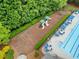 Aerial view of the community playground and pool area surrounded by lush trees at 1100 Carrington Pkwy, Villa Rica, GA 30180