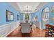 Inviting dining room with hardwood floors, a chandelier, and a view into the kitchen, ideal for entertaining at 1100 Carrington Pkwy, Villa Rica, GA 30180