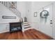 Bright foyer with hardwood floors, staircase, and a decorative front door, creating a welcoming entrance at 1100 Carrington Pkwy, Villa Rica, GA 30180