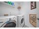 Well-lit laundry room with modern washer and dryer units at 1100 Carrington Pkwy, Villa Rica, GA 30180