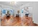 Spacious living room featuring hardwood floors, arched doorways, and access to the dining room and foyer staircase at 1100 Carrington Pkwy, Villa Rica, GA 30180