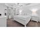 Well-lit primary bedroom with a ceiling fan, sitting area and neutral decor at 1100 Carrington Pkwy, Villa Rica, GA 30180