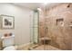 Beautiful bathroom featuring tiled shower with glass door and built-in shelf at 1386 Sheffield Glen Ne Way, Atlanta, GA 30329