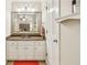 Bathroom vanity features granite countertops and mirror at 1386 Sheffield Glen Ne Way, Atlanta, GA 30329