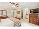 Bedroom features a view of the attached bathroom, carpet floors, and neutral walls at 1386 Sheffield Glen Ne Way, Atlanta, GA 30329
