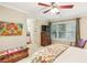 Bright bedroom showcasing a chest, large windows, and neutral walls with adjacent ensuite bathroom at 1386 Sheffield Glen Ne Way, Atlanta, GA 30329