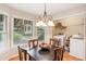 Bright dining nook features windows, a chandelier, and convenient laundry access at 1386 Sheffield Glen Ne Way, Atlanta, GA 30329