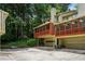 Exterior view of townhomes featuring garages and screened-in porches at 1386 Sheffield Glen Ne Way, Atlanta, GA 30329