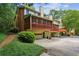 View of the townhome exterior with a garage and screened in deck at 1386 Sheffield Glen Ne Way, Atlanta, GA 30329