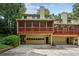 View of a townhome with screened-in porch and garage at 1386 Sheffield Glen Ne Way, Atlanta, GA 30329