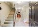 Inviting foyer with staircase, tile floors, and a view into the spacious living area at 1386 Sheffield Glen Ne Way, Atlanta, GA 30329