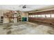 Spacious garage with plenty of storage shelving, bins, and an automatic door at 1386 Sheffield Glen Ne Way, Atlanta, GA 30329