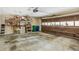 Spacious garage with an automatic door, storage shelves, and a clean concrete floor at 1386 Sheffield Glen Ne Way, Atlanta, GA 30329