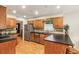 Spacious kitchen with stainless steel appliances, wood cabinets, and breakfast bar at 1386 Sheffield Glen Ne Way, Atlanta, GA 30329