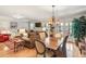 Open-concept living and dining area with hardwood floors and natural light at 1386 Sheffield Glen Ne Way, Atlanta, GA 30329