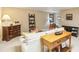 Living room featuring neutral carpet, comfortable seating, and wooden furniture at 1386 Sheffield Glen Ne Way, Atlanta, GA 30329