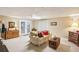 Spacious living room with neutral carpet, comfortable seating, and warm lighting at 1386 Sheffield Glen Ne Way, Atlanta, GA 30329