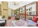 Relaxing screened porch with comfortable seating and scenic views at 1386 Sheffield Glen Ne Way, Atlanta, GA 30329