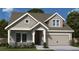 Charming single-story home featuring board and batten siding, stone accents, and an attached two-car garage at 207 Strawberry Lane, Woodstock, GA 30189