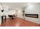 View of basement living space with hardwood floors, dining area, and fireplace at 2148 Allgood Rd, Marietta, GA 30062