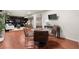 View of basement living space with hardwood floors, television, and seating area at 2148 Allgood Rd, Marietta, GA 30062
